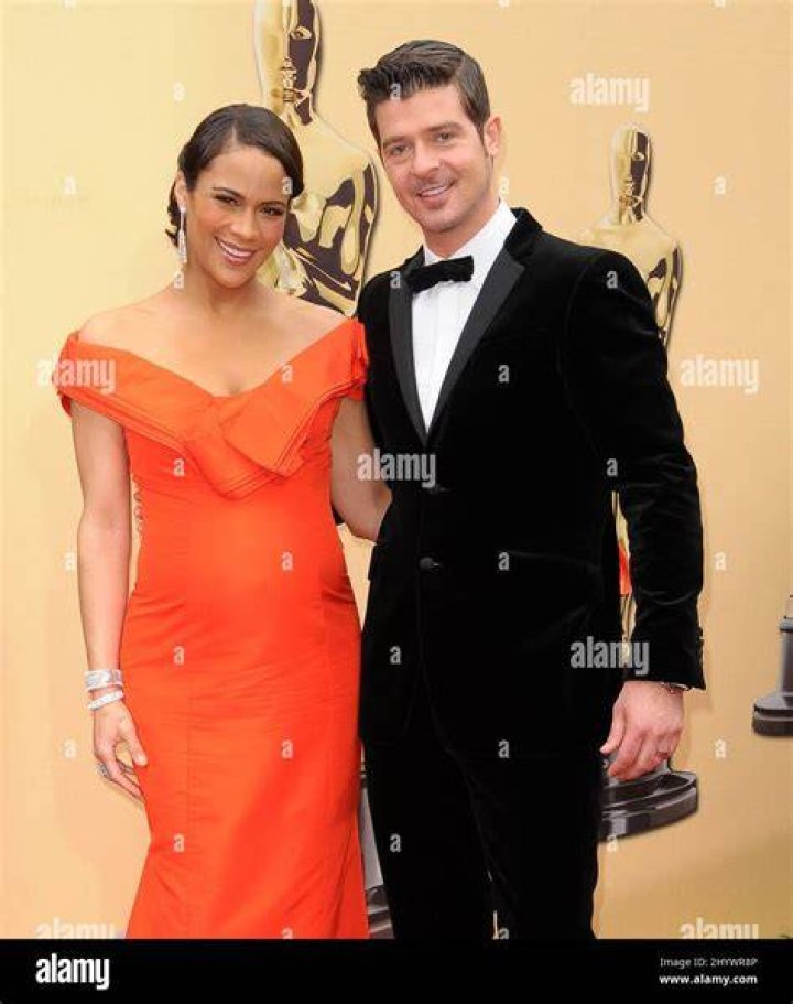 Paula Patton and husband Robin Thicke arrive at the Keep a Child Alive